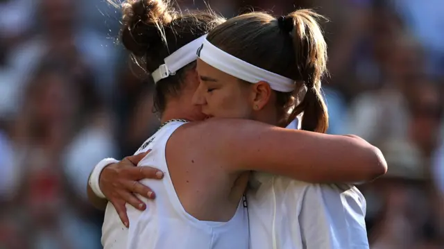 Karolina Muchova hugs Linda Noskova