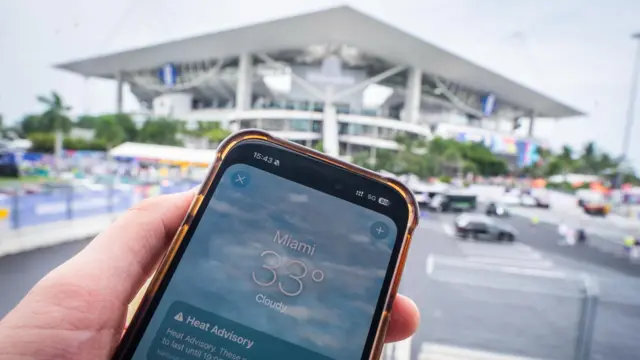 Phone shows heat advisory warning outside Miami Stadium