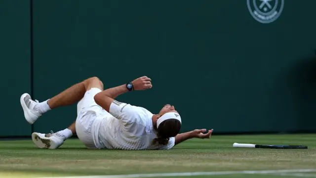 Alexander Zverev on the ground after slipping