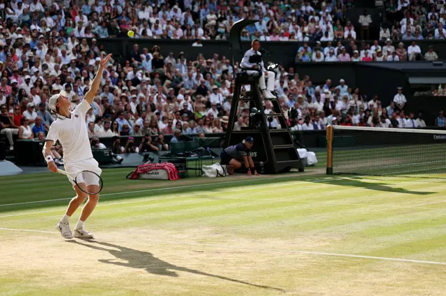 Jannik Sinner serves at Wimbledon