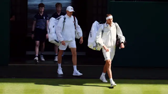 Alexander Zverev and Jannik Sinner walk on to Centre Court
