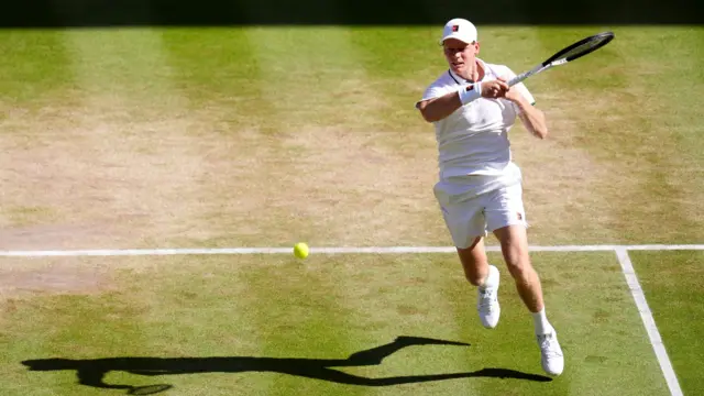Jannik Sinner hits a forehand