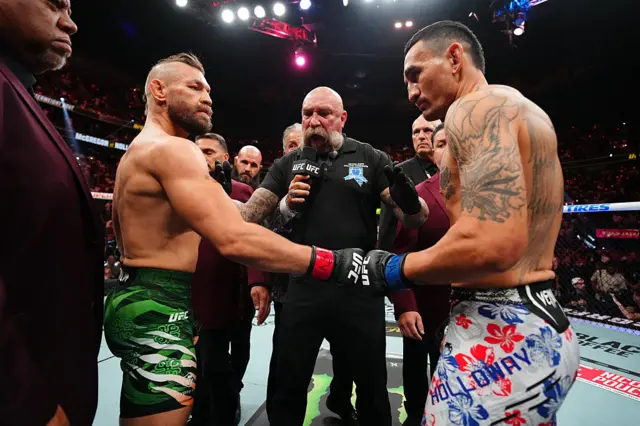 Conor McGregor fist bumps Max Holloway