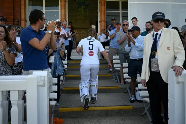 Heather Knight walking off