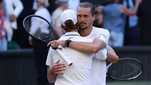 Alexander Zverev embraces Jannik Sinner