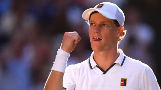 Jannik Sinner celebrates with a clenched fist