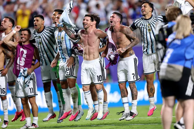 Lionel Messi and teammates applaud fans