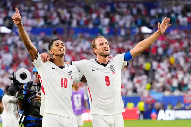 Jude Bellingham of England celebrates the victory with Harry Kane