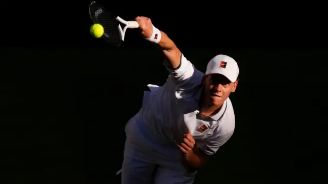 Jannik Sinner serves