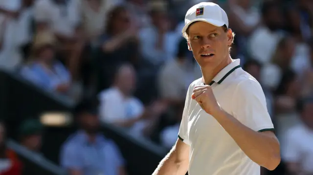 Jannik Sinner celebrates with a clenched fist