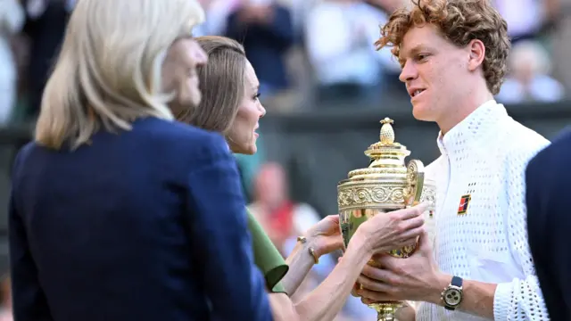 Jannik Sinner receives the Wimbledon trophy