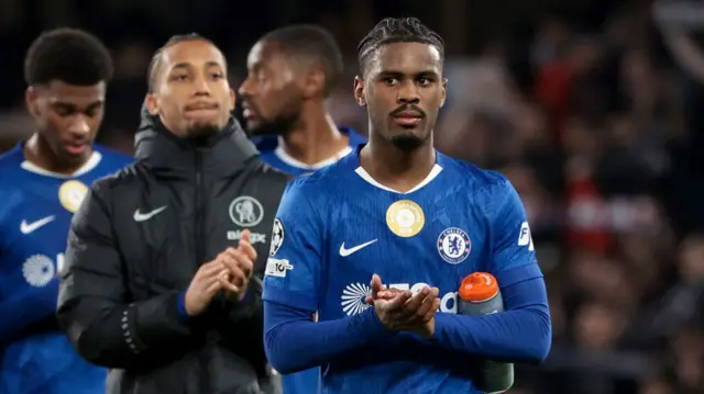 Jarrel Hato of Chelsea salutes the supporters following the UEFA Champions League 2025/26 Round of 16 Second Leg match between Chelsea FC and Paris Saint-Germain (PSG) at Stamford Bridge stadium on March 17, 2026 in London, England.