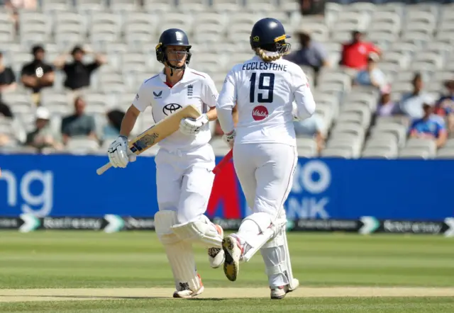 England's Amy Jones and Sophie Ecclestone in action running between the wickets