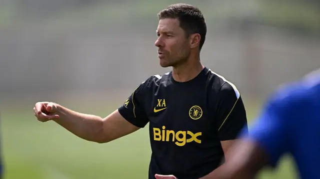 Xabi Alonso pointing with his right arm outstretched