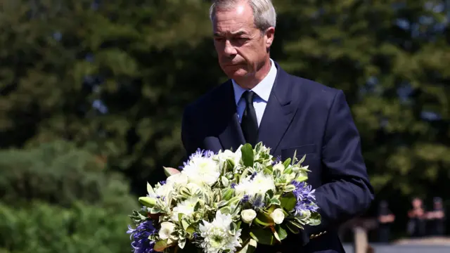 Leader of the Reform UK party Nigel Farage lays flowers at Dartmoor National Park near the home of former government minister and Reform UK party member Ann Widdecombe after she was found dead on Thursday, in Haytor, Britain, July 11, 2026.