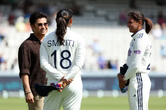 Former India cricketer Sachin Tendulkar with Smriti Mandhana and Harmanpreet Kaur before the start of day 4