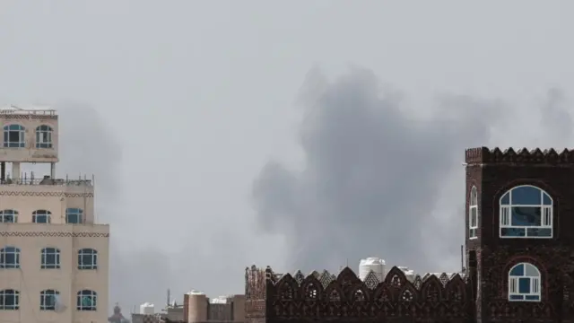 Smoke rises after an airstrike hit the Sanaa International Airport in Yemen.
