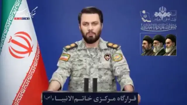 Man in military fatigues reads statement on Iranian media