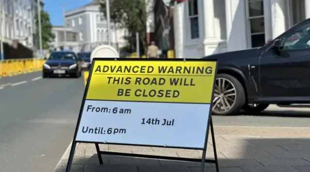 A road sign detailing road closures on a street in Douglas