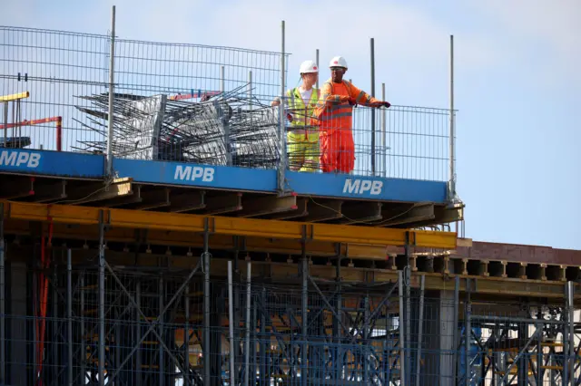 Builders watch on