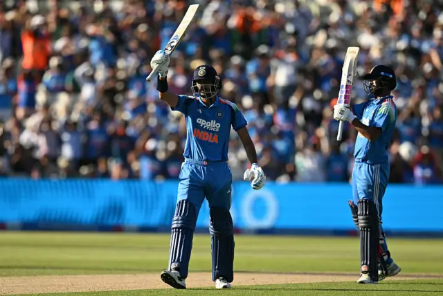 India's Axar Patel and Washington Sundar salute the fans after wrapping up a six-wicket win over England