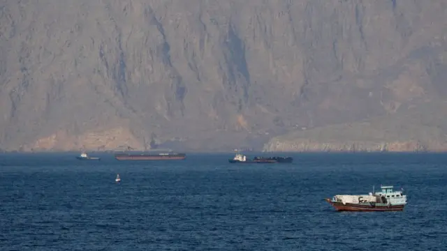 Ships and tankers in the Strait of Hormuz off the coast of Musandam, Oman