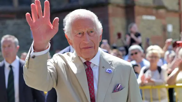 King Charles waves