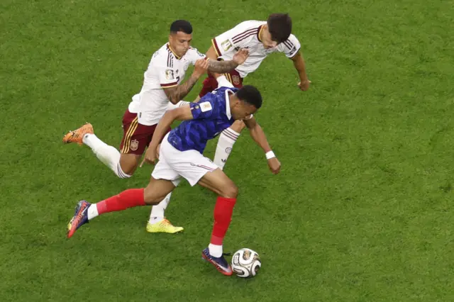 Mbappe is pursued by several defenders