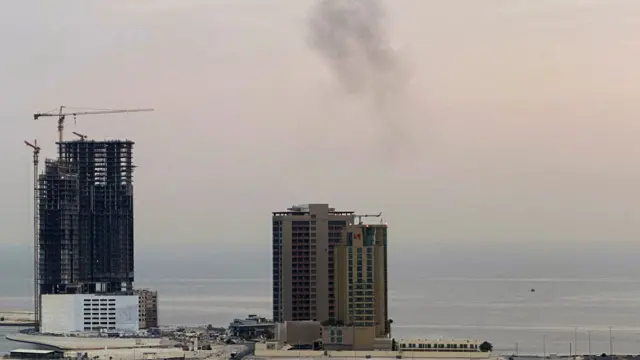 Two buildings in Bahrain. Smoke rises after a drone was intercepted.