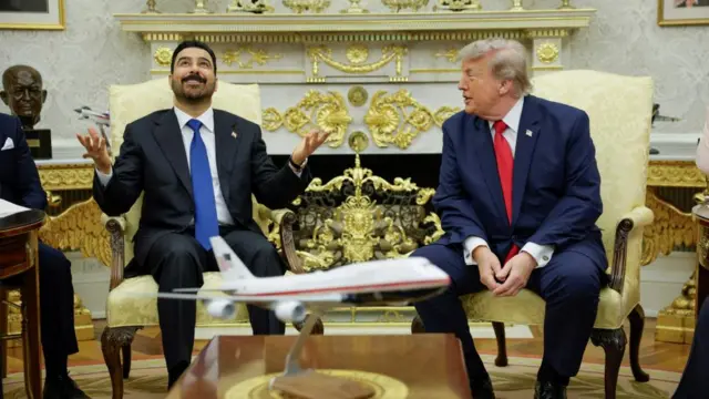 Iraqi Prime Minister Ali al-Zaidi next to Donald Trump in the Oval Office.