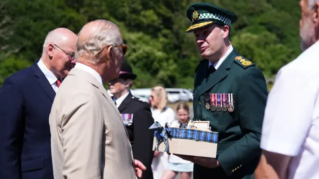 King Charles III, Lord of Mann, is gifted a bell from a retired ambulance
