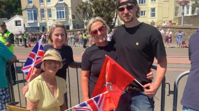 Margaret with the family holding flags