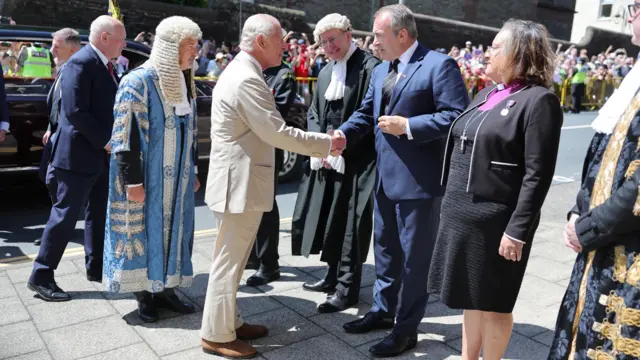 King Charles shakes hands with the Chief Minister