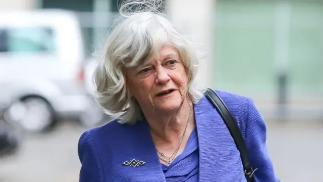 Ann Widdecombe, an older white lady with white hair, in a purple suit.