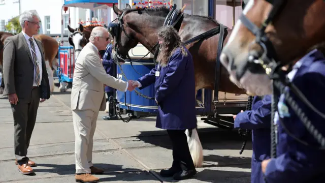 The King meets horse tram staff