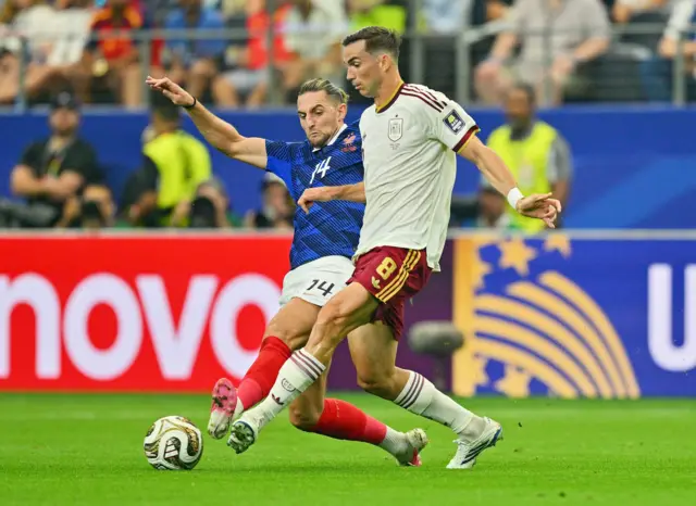 Rabiot flies into a tackle on Ruiz