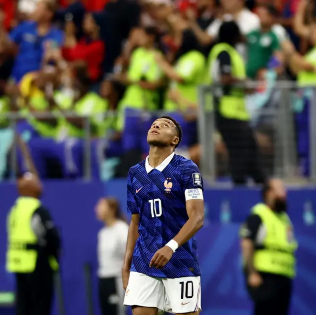 Mbappe looks to the heavens