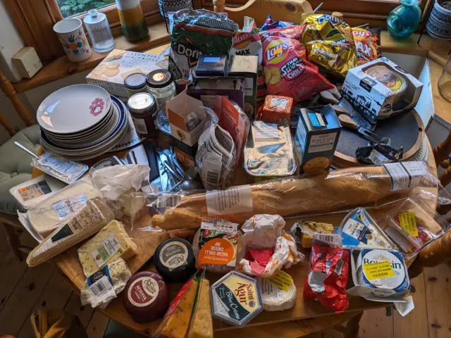 A table full of food and cheese