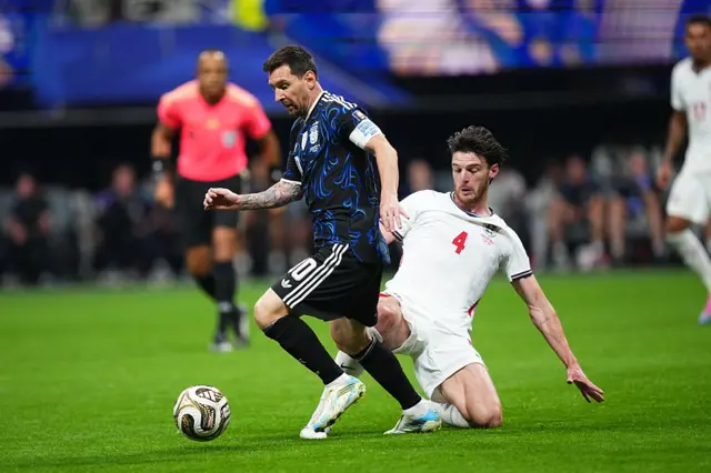 Messi is tackled by Rice