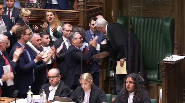 Sir Lindsay Hoyle shaking hands with Prime Minister Sir Keir Starmer as he leaves his last Prime Minister's Questions
