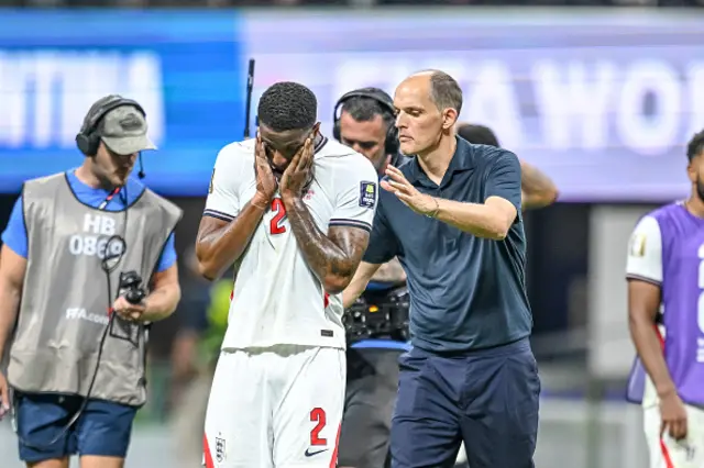 Ezri Konsa of England and coach Thomas Tuchel of England gestures