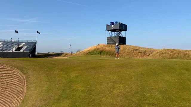 A caddie on the 5th green on Wednesday at Royal Birkdale