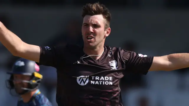 Craig Overton celebrates taking a wicket