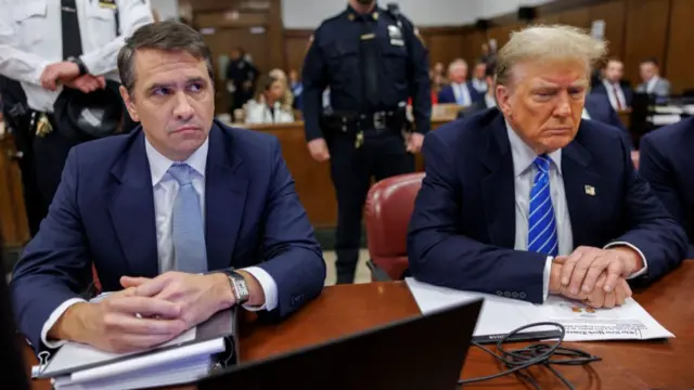 Todd Blanche sits next to Donald Trump in a Manhattan courtroom in 2024.
