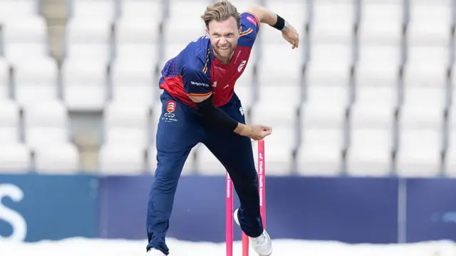 Sam Cook bowling for Essex
