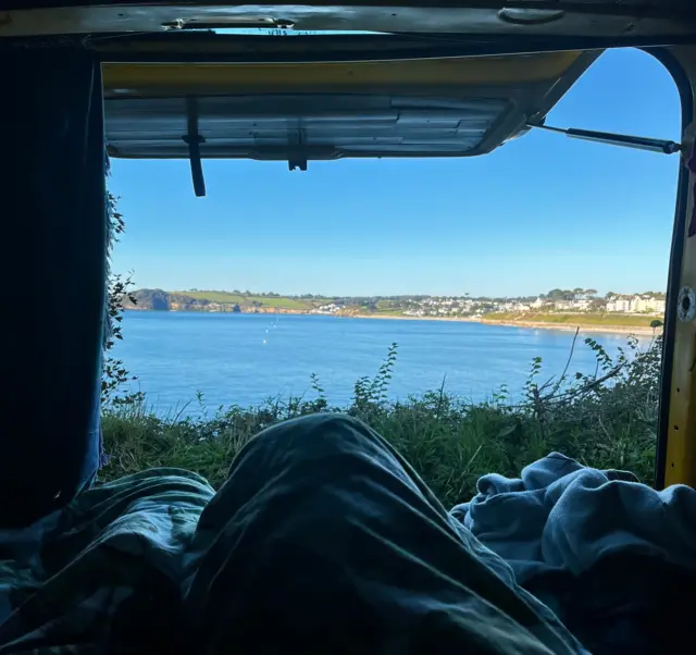Picture of a lake outside a van