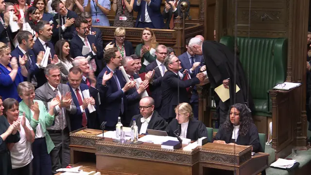 Starmer shakes Hoyle's hand