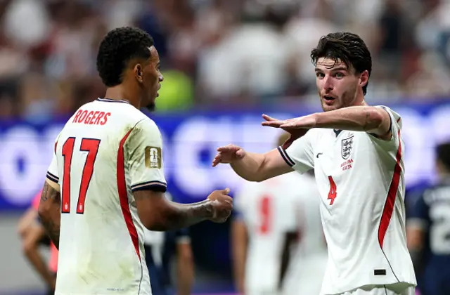 Morgan Rogers #17 and Declan Rice #4 of England react