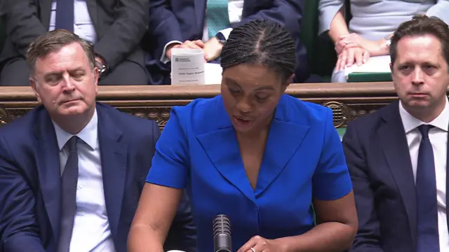 Kemi Badenoch wearing blue dress