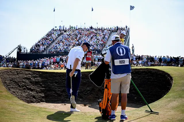 Justin Rose of England prepares to play his second shot on the seventh hole